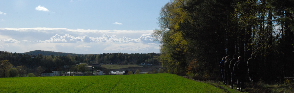 Foto av skjermet indre slakt til småkupert kystslettelandskap med tett bebyggelse og jordbruksdominans